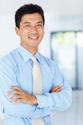 Testimonial photo of a man with arms corssed